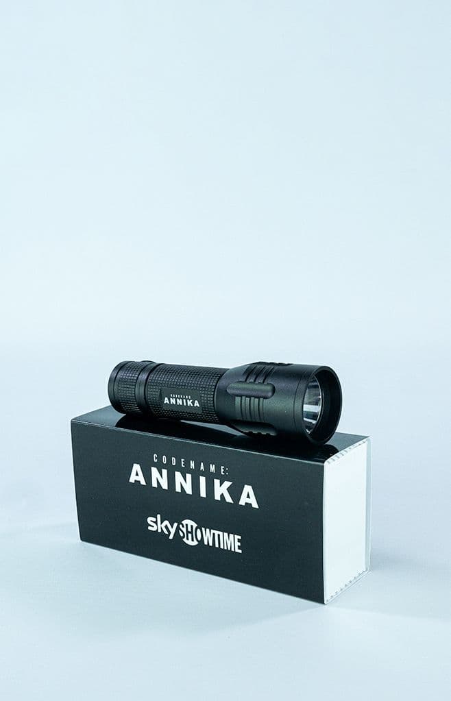 a flashlight sitting on top of a box that says sky showtime