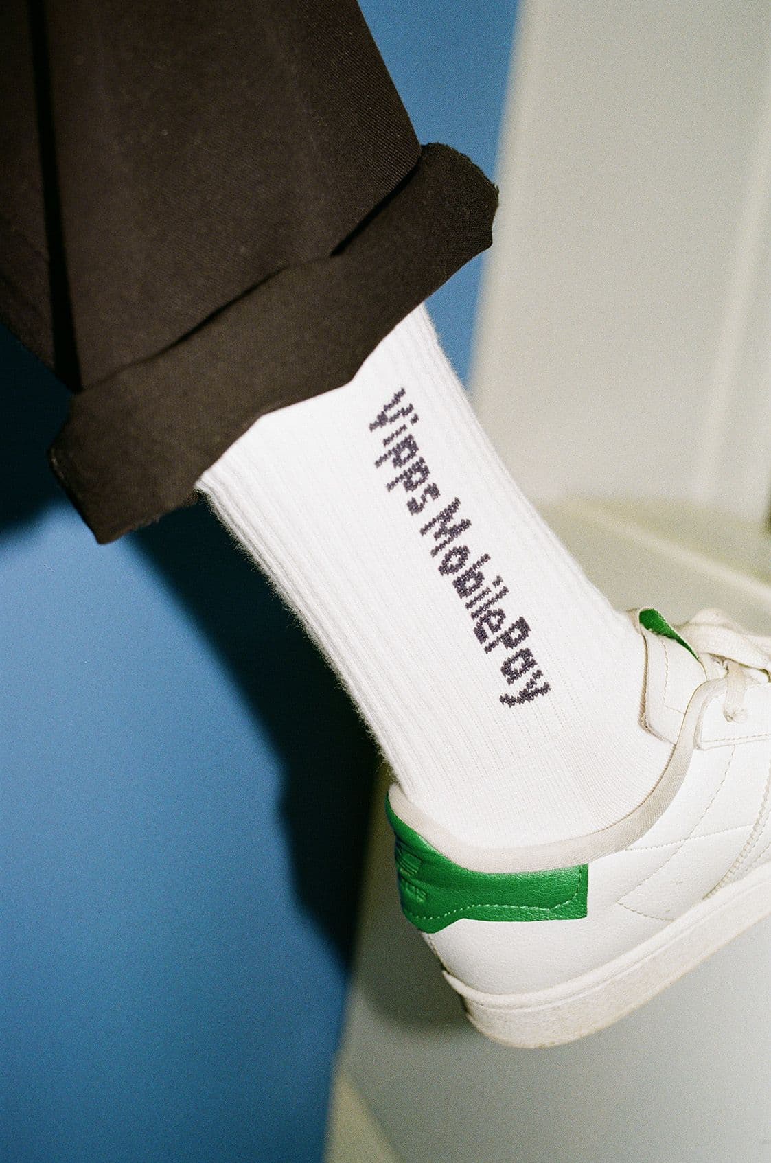 a person wearing a pair of socks that say ' i 'm a nobody ' on them